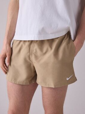 Nike Tan Athletic Shorts with White Swoosh